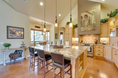 a large kitchen with a large table and chairs at Furnished Decks and Grill Peaceful Pioneer Home! in Pioneer