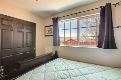a bedroom with a window and a bed and a door at Gateway to Mt Rose Ski! Reno Home Near Casinos in Reno