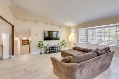 a living room with a couch and a flat screen tv at Gateway to Mt Rose Ski! Reno Home Near Casinos in Reno