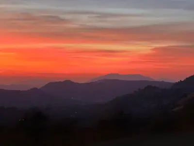 a sunset over a mountain range at The Sequoia guesthouse in Miramonte