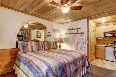 a bedroom with a bed and a ceiling fan at Heavenly Valley Lodge in South Lake Tahoe