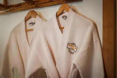 three white shirts hanging on a wall at Heavenly Valley Lodge in South Lake Tahoe