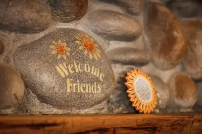 a rock with the words welcome friends written on it at Heavenly Valley Lodge in South Lake Tahoe
