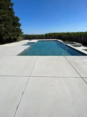 a swimming pool on the side of a sidewalk at Adorable One Bedroom Cottage in Oakdale