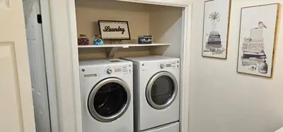 a laundry room with a washer and dryer at Magnolia Peaceful Vibes Cozy Near Hospital in Hanford