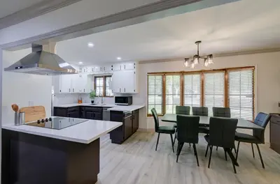 a kitchen and dining room with a table and chairs at The Cedar Tree in Fresno