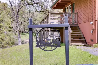 a sign for a golf cabin in front of a house at Groveland Vacation Rental about 24 Mi to Yosemite! in Groveland