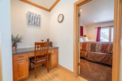 a bedroom with a desk and a bed at Rr-johnson Suite 2 in June Lake