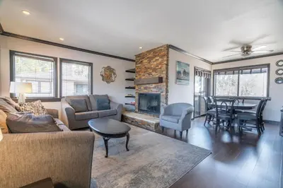 a living room with a couch and a fireplace at Rr-edgewater16 in June Lake