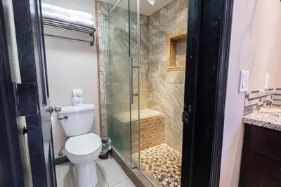 a bathroom with a toilet and a glass shower at Rr-edgewater16 in June Lake