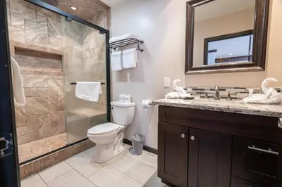 a bathroom with a shower and a toilet and a sink at Rr-edgewater16 in June Lake