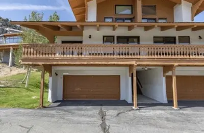 a large house with a balcony and a garage at Rr-interlaken 17 in June Lake