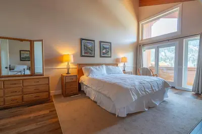 a bedroom with a bed and a large window at Rr-interlaken 17 in June Lake