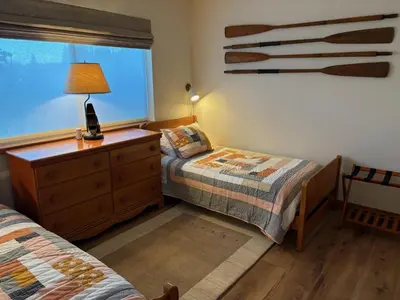 a bedroom with two beds and a dresser and a window at Rr-edgewater09 in June Lake