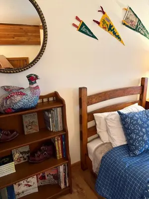 a bedroom with a bed and a mirror on the wall at Rr-edgewater09 in June Lake