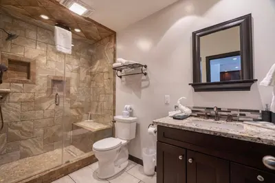 a bathroom with a shower and a toilet and a sink at Rr-edgewater20 in June Lake