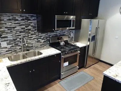a kitchen with a stove and a stainless steel refrigerator at Rr-edgewater20 in June Lake