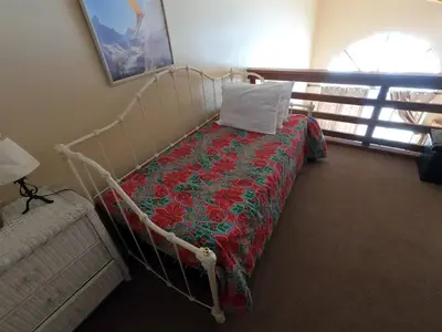 a bedroom with a bed with a red and green blanket at Rr-edgewater13 in June Lake