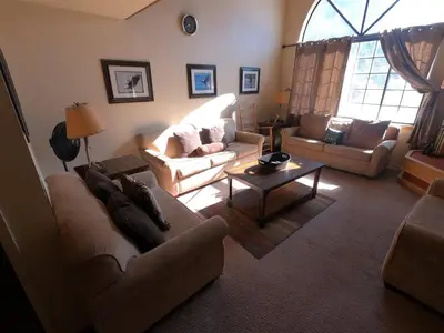 a living room with two couches and a table at Rr-edgewater13 in June Lake