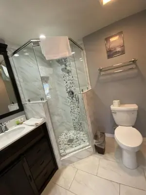 a bathroom with a shower with a toilet and a sink at Rr-edgewater17 in June Lake