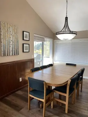 a dining room with a wooden table and chairs at Rr-edgewater17 in June Lake