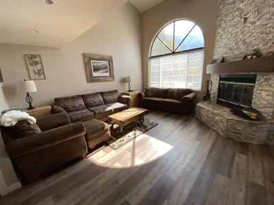a living room with a couch and a fireplace at Rr-edgewater17 in June Lake
