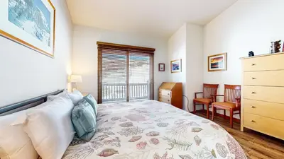 a bedroom with a bed and a dresser and a window at Snowcreek V #784 condo in Mammoth Lakes