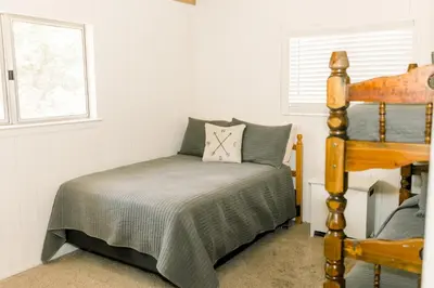 a bedroom with a bed and a window at Moreno-Lake Area Free Night Special in Bass Lake