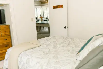 a bedroom with a bed and a desk in a room at Moreno-Lake Area Free Night Special in Bass Lake