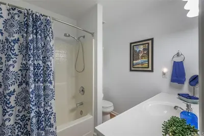 a bathroom with a shower and a tub and a toilet at Rosenberg Slide Creek Reduced Nightly Rate in Bass Lake