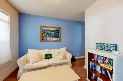 a living room with a couch and a blue wall at Charming Mt Rose Retreat in South Lake Tahoe