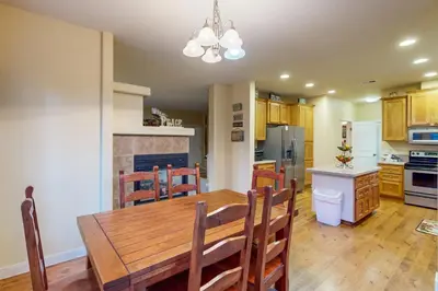 a kitchen and dining room with a wooden table and chairs at Charming Mt Rose Retreat in South Lake Tahoe