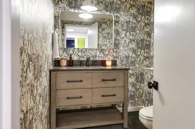 a bathroom with a sink and a mirror at Deck and Fire Pit Stunning Twain Harte Cabin! in Twain Harte
