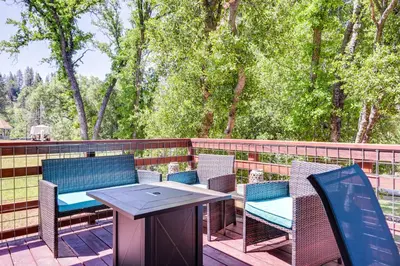 a patio with chairs and a table on a deck at Groveland Home - Walk to Pine Mountain Lake! in Groveland