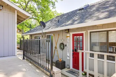 a house with a red door and a fence at Groveland Home - Walk to Pine Mountain Lake! in Groveland