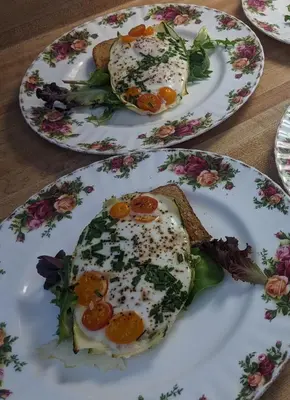 two plates with food on them on a table at The Parks Inn in Three Rivers