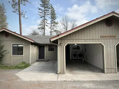 a house with a garage with a washer and dryer at Prime location Yosemite Expedition by Casa Oso in Oakhurst