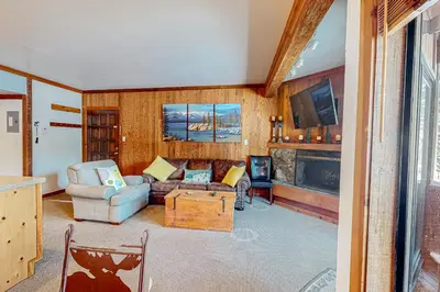 a living room with a couch and a fireplace at Mountain Time Escape in Olympic Valley