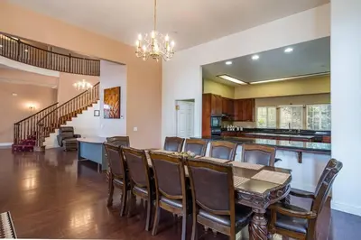 a dining room with a table and chairs at Yosemite South Presidential Mansion in Coarsegold