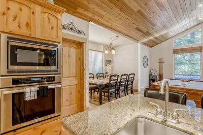 a kitchen and dining room with a dining table at Tahoe Discovery in South Lake Tahoe