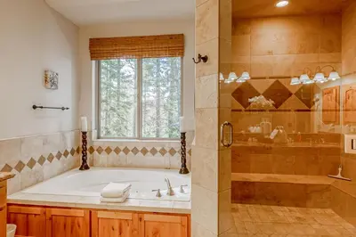 a large bathroom with a tub and a shower at Tahoe Discovery in South Lake Tahoe