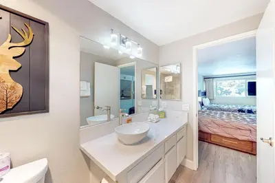 a bathroom with a sink and a mirror at Mountain Shadows H6 in Mammoth Lakes