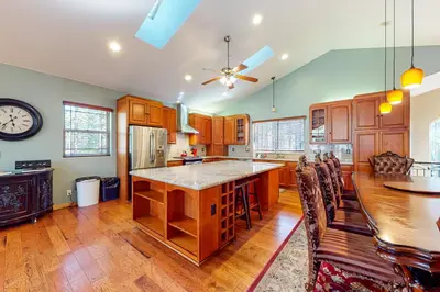 a large kitchen with wooden cabinets and a large island at Heavenly Lake Hideaway in South Lake Tahoe