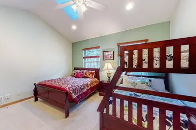 a bedroom with a bunk bed and a staircase at Heavenly Lake Hideaway in South Lake Tahoe