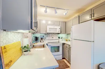 a kitchen with white appliances and a white refrigerator at Tranquil Haven Retreat - DSTR1068 in Stateline