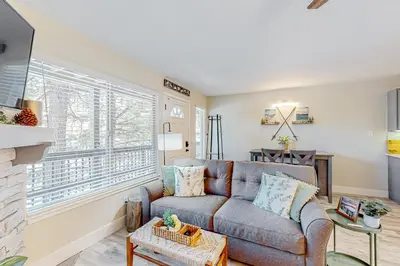 a living room with a couch and a fireplace at Tranquil Haven Retreat - DSTR1068 in Stateline