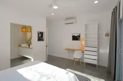 a white bedroom with a desk and a bed at Eagle Rock Nest ～Quiet & Gorgeous Mountain Views in Three Rivers