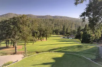 a view of a golf course with a green at Marina Beach Cabin - Dog-Friendly Home with Deck! home in Groveland