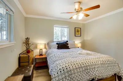 a bedroom with a bed and a ceiling fan at Welcoming South Lake Tahoe Rental Near Beaches in South Lake Tahoe