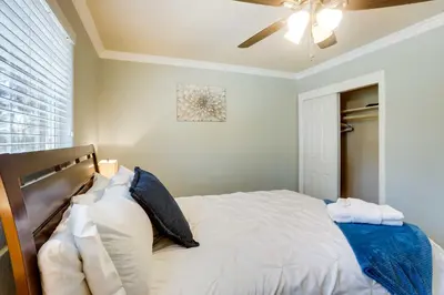 a bedroom with a bed with a ceiling fan at Welcoming South Lake Tahoe Rental Near Beaches in South Lake Tahoe